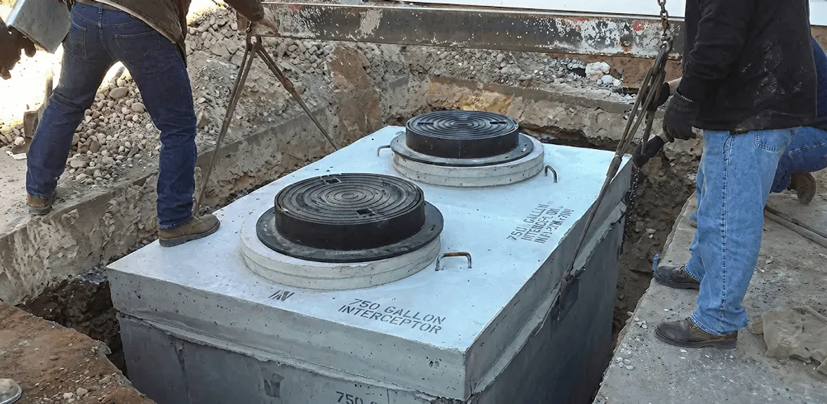 Grease trap installation for a commercial property drainage system in Chicago, IL