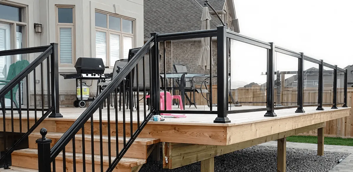 Handrail installation on a deck staircase for safety and code compliance in Chicago, IL